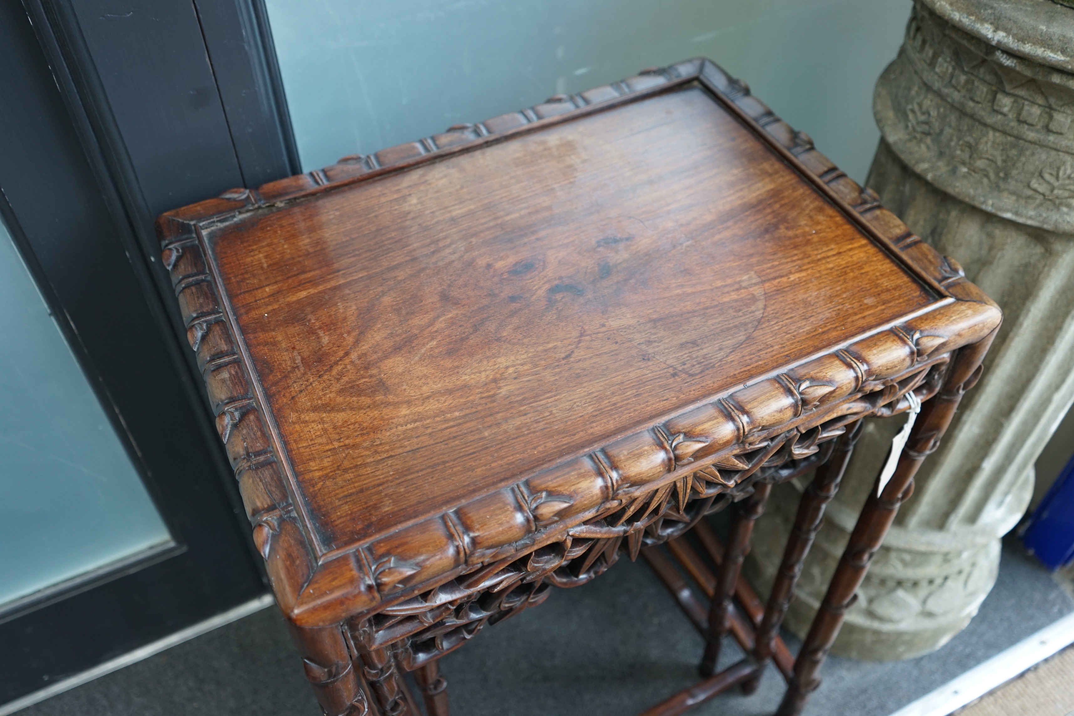 A nest of three Chinese hongmu rectangular tea tables, early 20th century, width 52cm, depth 39cm, height 74cm